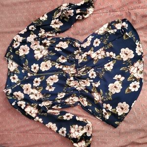A blue top with pink flowers